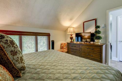 a bedroom with a bed and a dresser and a television at Top Of Seven in Seven Devils