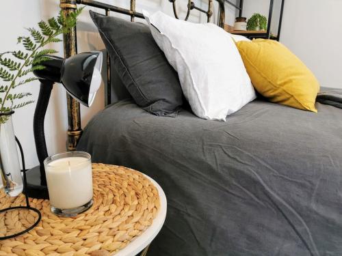 a table with a glass of milk on a bed at Tuia Retreat in Whangaparaoa