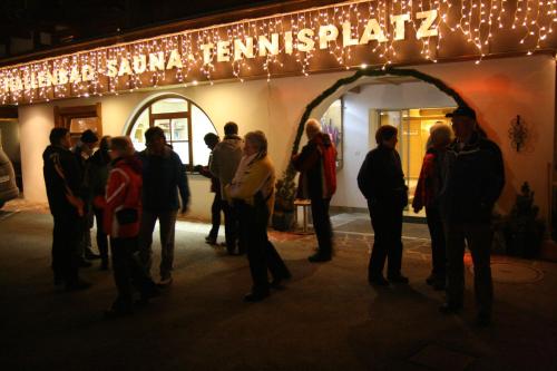 a group of people standing outside of a store at Aktiv-Hotel Traube am Mieminger Sonnenplateau in Wildermieming