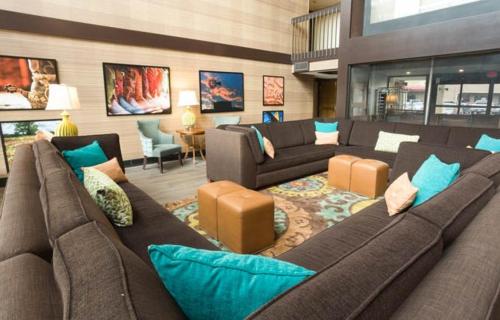 a large living room with couches and a couch at McAllen Plaza Hotel and Suites in McAllen