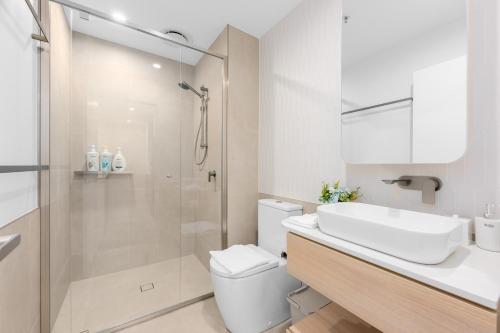 a bathroom with a shower and a toilet and a sink at Chic Woden Apt, Near Hospital, Westfield w Pool in Phillip