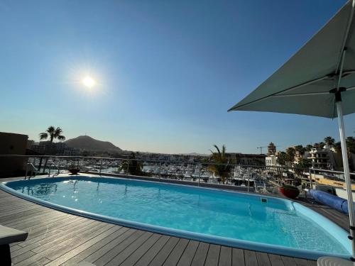 a swimming pool on the roof of a hotel at Casa Pura Vida in Cabo San Lucas