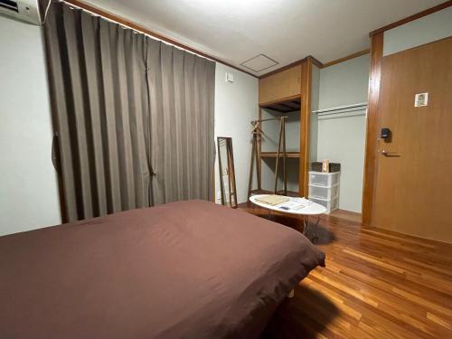 Postel nebo postele na pokoji v ubytování Arcade Resort Okinawa