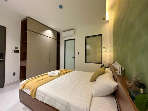 Postel nebo postele na pokoji v ubytování Liora Hotel Dalat