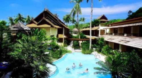a group of people in a swimming pool at a resort at Phi Phi Banyan Villa in Phi Phi Don