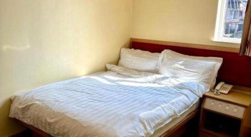 Ένα ή περισσότερα κρεβάτια σε δωμάτιο στο Man Va Hotel