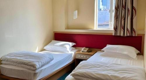 Ένα ή περισσότερα κρεβάτια σε δωμάτιο στο Man Va Hotel