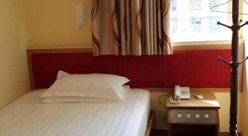 Ένα ή περισσότερα κρεβάτια σε δωμάτιο στο Man Va Hotel