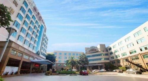 a city with tall buildings and a street with cars at Quanzhou Royal Prince Hotel in Quanzhou