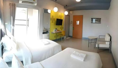 Katil atau katil-katil dalam bilik di A+ Hotel