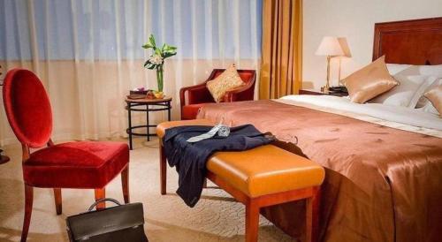 Кровать или кровати в номере Jiaxing Sunshine Hotel