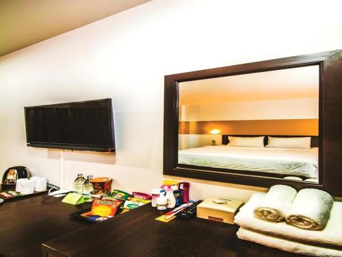 Cama o camas de una habitación en Mukdaview Hotel