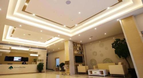 a large lobby with a coffered ceiling in a building at GreenTree Inn Xuancheng Jingxian Wannan First Street Express Hotel in Xuanzhou