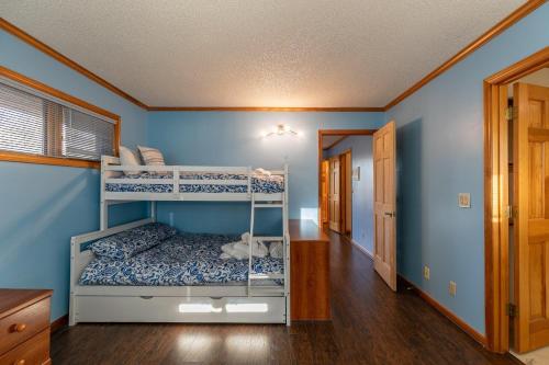a bedroom with two bunk beds in a house at Eagles Rest in Fleetwood