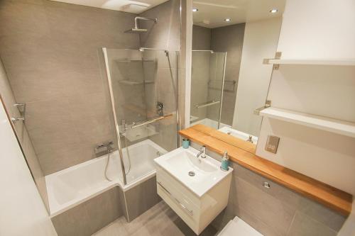 a bathroom with a shower and a toilet and a sink at Clock Tower 2 - Central - by Brighton Holiday Lets in Brighton & Hove