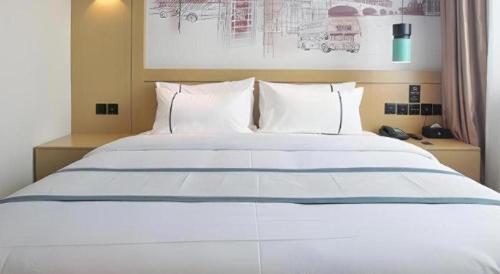 Letto o letti in una camera di City Comfort Inn Jinan West Station Shandong International Convention and Exhibition