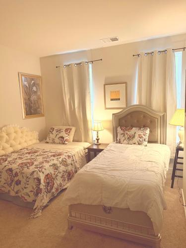 a bedroom with two beds and a window at Red sound retreat in Laurel