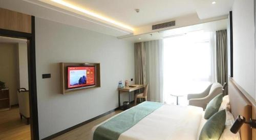 Μια τηλεόραση ή/και κέντρο ψυχαγωγίας στο GreenTree Inn Anqing Yingbin Dong Road High-Speed Railway Station