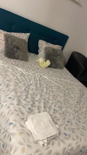 a bed with a stuffed animal laying on it at apartament 1 camera in Roşu