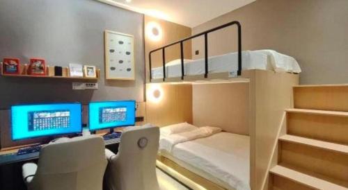 Postel nebo postele na pokoji v ubytování Shenzhen Nan Fei Yuan Hotel
