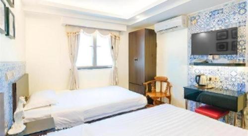 TV a/nebo společenská místnost v ubytování Hou Kong Hotel