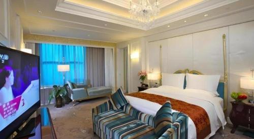 TV a/nebo společenská místnost v ubytování Yuncheng Jianguo Hotel