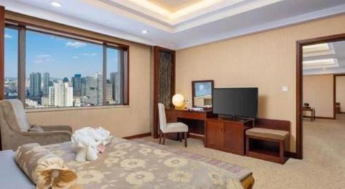 Kunming Jinjiang Hotelにあるテレビまたはエンターテインメントセンター