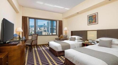 Kunming Jinjiang Hotelにあるテレビまたはエンターテインメントセンター
