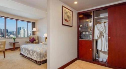 Kunming Jinjiang Hotelにあるベッド