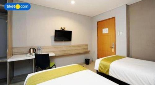 Ένα ή περισσότερα κρεβάτια σε δωμάτιο στο dPalma Hotel