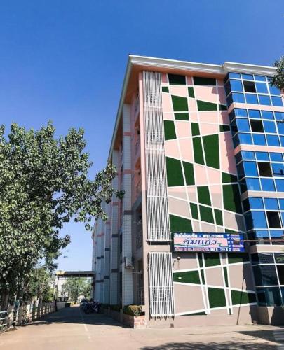 a large building with a checkerboard pattern on it at Kumkaew Udon in Udon Thani