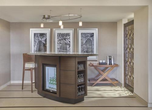 an island in a room with a bar in it at Hyatt Regency Milwaukee in Milwaukee