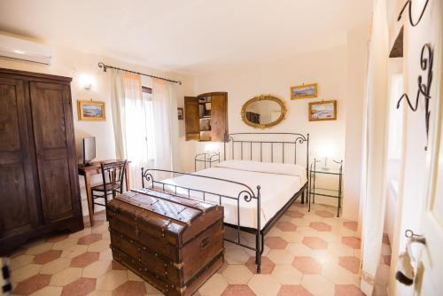 Postel nebo postele na pokoji v ubytování Nenà Al Borgo Castello