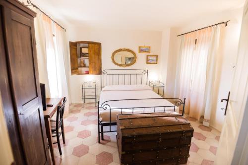 Postel nebo postele na pokoji v ubytování Nenà Al Borgo Castello
