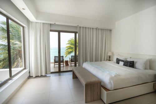 Кровать или кровати в номере Hodges Bay Resort & Spa, an HQ Luxury Resort & Residences