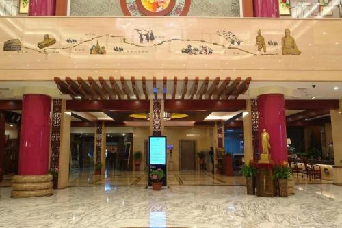 a large building with a sign in the middle at New Friendship Hotel in Luoyang