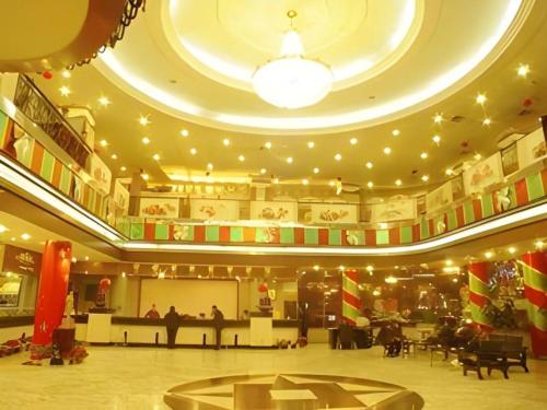 a large room with a concert hall with lights at New Friendship Hotel in Luoyang