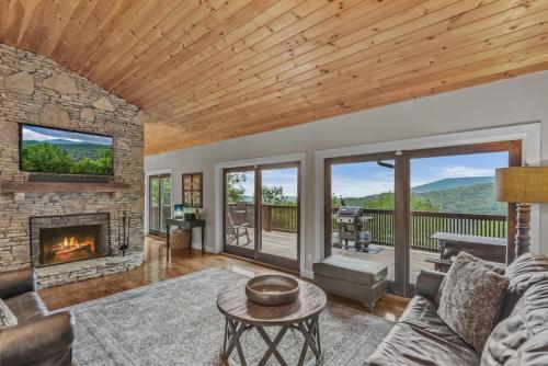 a living room with a couch and a fireplace at Starlight Ridge in Seven Devils
