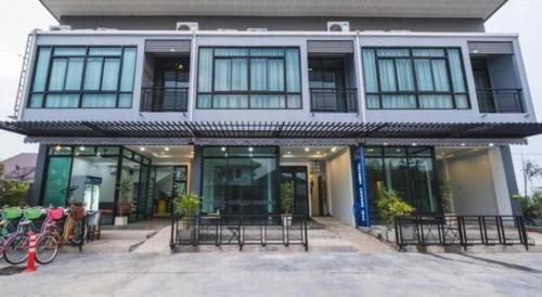 a building with bikes parked in front of it at The Smart Hostel in Nakhon Ratchasima