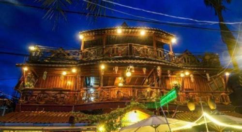 a large building with lights on it at night at Green Ocean Koh Rong in Koh Rong Island