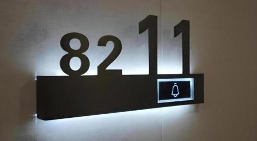 a sign on a wall with a number on it at GreenTree Inn Express Hebei Shijiazhuang Zhengding County Changshan Dong Road in Shijiazhuang