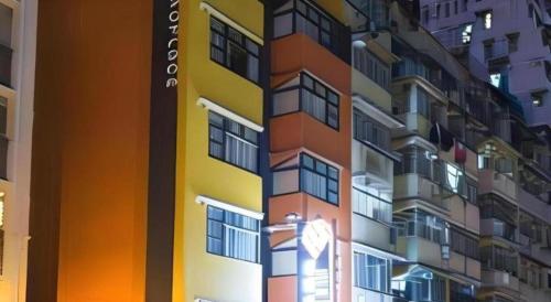 a tall building with a sign on the side of it at Metroplace Olympic in Hong Kong