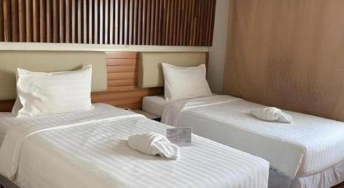Postel nebo postele na pokoji v ubytování Cactus Resort & Hotel