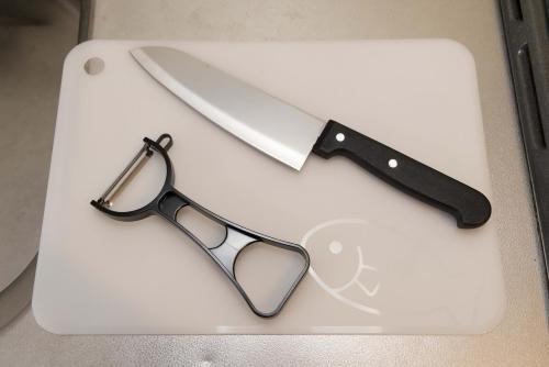 a pair of glasses and a knife on a cutting board at Befu Good Place House in Fukuoka