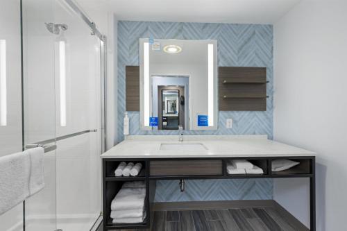 a bathroom with a sink and a shower at Hilton Garden Inn Gallatin in Gallatin