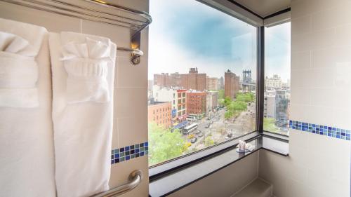 a window in a bathroom with a view of a city at Hotel Richland LES in New York