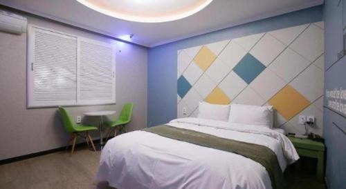 Кровать или кровати в номере Luxury Motel Daejeon