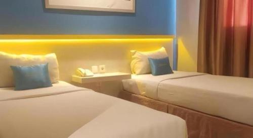 Кровать или кровати в номере Zenith Hotel