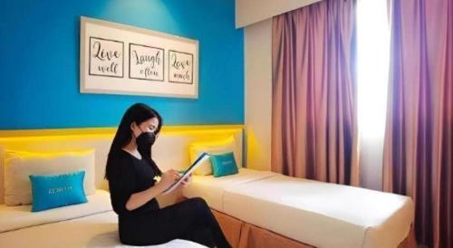Кровать или кровати в номере Zenith Hotel