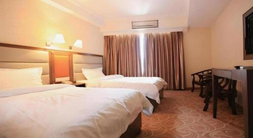 Кровать или кровати в номере Towns Well Motel